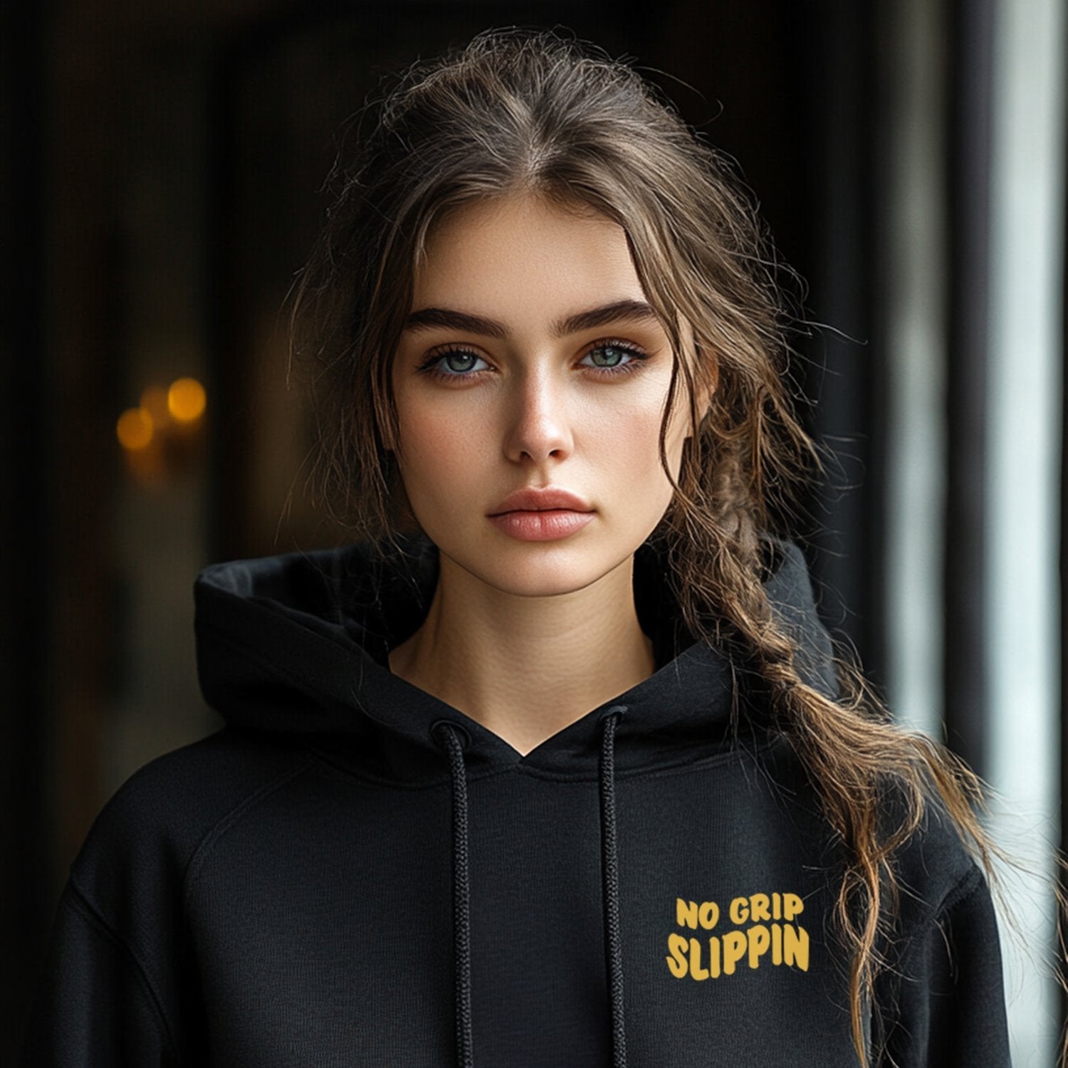 female model wearing black hoodie with no grip slippin on the front