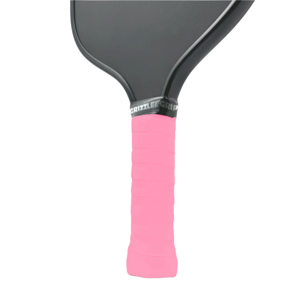 Close-up of a light pink pickleball paddle overgrip grip with 'Grizzlee' branding on a gray background