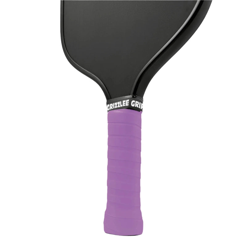 Close-up of a light purple pickleball paddle overgrip with 'Grizzlee Gripz' branding on a gray background