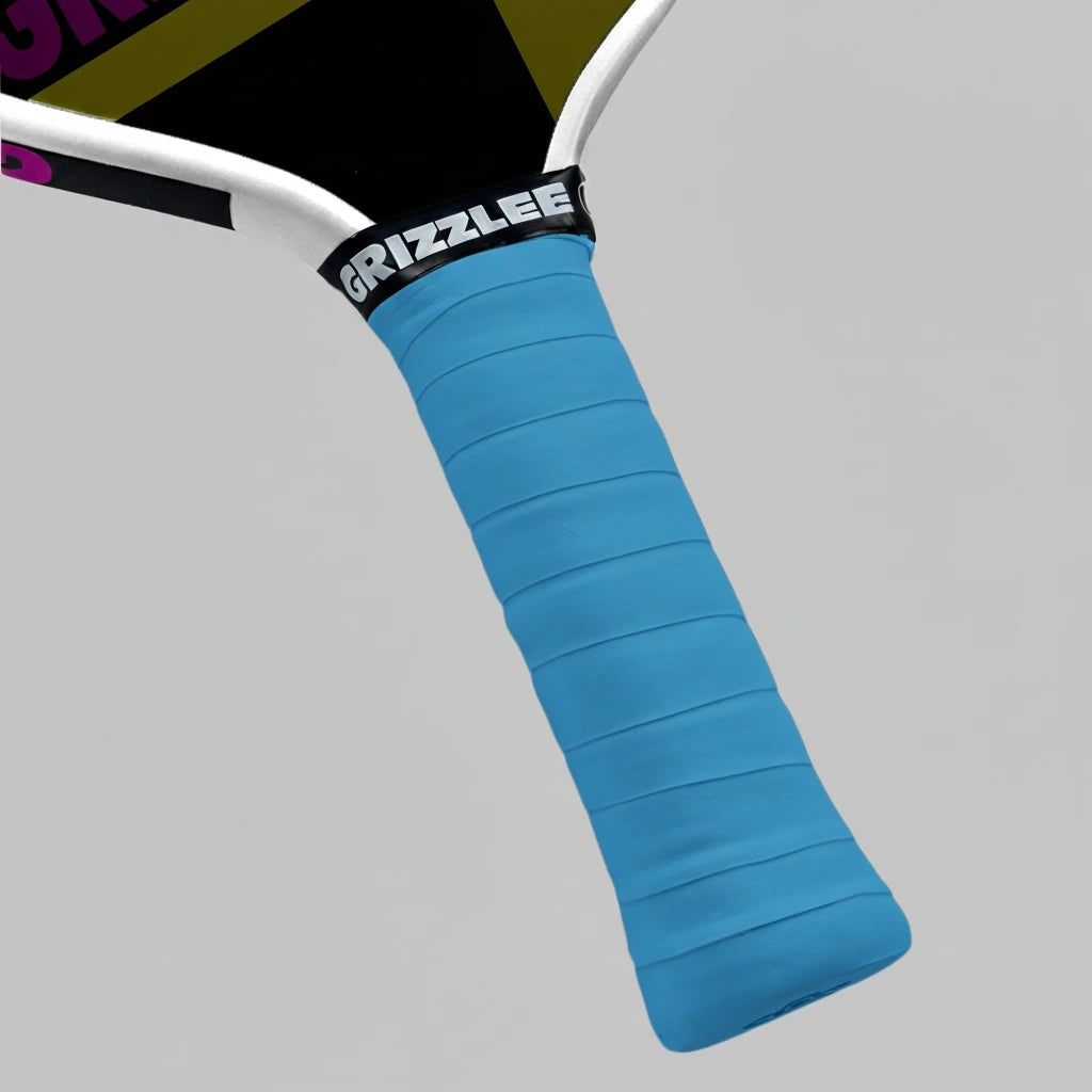 Blue pickleball paddle overgrip with 'Grizzlee Gripz' branding on a gray background